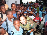 Chilean Captain Fuentes with children at a school in Haiti. Credit: Courtesy of Chilean Army