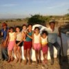 Family in northeast Brazil proudly display their rainwater tank. Credit: Roberta Guimarães, courtesy ASA
