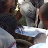 Children have been drafted in to assist with surveying water quality as part of raising public awareness of the river's health. Credit:  Tinus de Jager