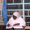 Samia Ahmed Mohamed, former Sudanese minister for social welfare, signs optional protocol of the convention on the rights of the child in 2002. Credit:  UN Photo