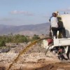 A"desludging truck" shoots excreta into the pit at Trutier. Credit: WASH Cluster, Haiti