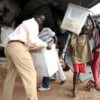 Voting materials are unloaded from a UN helicopter in Tali Payam, a district inaccessible by road, in Southern Sudan