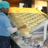 Turning out 36,000 flat breads in an hour, this machine highlights technical innovations that help to feed deprived school children. Credit: Manipadma Jena/IPS