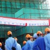 Shanghai Construction Company workers outside Malawi's new five-star hotel. Credit:  Claire Ngozo/IPS