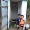 Toilet-trained kids use a microfinanced facility in their backyard in a Bhubaneswar slum. Credit: Manipadma Jena/IPS.