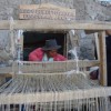 Vilma Matías weaving on a loom at the Lucanamarca workshop. Credit: Milagro Salazar/IPS