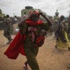 Somali women rush to a feeding centre after the soldiers of the Transitional Federal Government cannot contain the crowd in Badbado, an IDP camp. Credit: UN Photo/Stuart Price