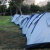 High housing costs drive people to living in tents in a Jerusalem park. Credit: Jillian Kestler-D
