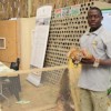 Nelson Haulamba, a young farmer with the Boschveld Chicken, a cross of three indigenous chicken breeds in Africa.  Credit: Marianne Pretorius/IPS