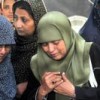 Mourning at a funeral for violence victims. Credit: Fahim Siddiqi/IPS.