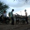 Two men wheel out some of their possessions from the Boeung Kak lakeside. Credit: Robert Carmichael