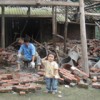 Picking up the pieces after the quake in Bailu town, Sichuan Province. Credit: Antoaneta Bezlova/IPS