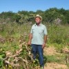 Francisco Soares Oliveira in his field. His maize and bean crops were lost to this year's unusual floods. Credit: Mario Osava/IPS