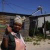 A thumbs up for solar water heating in Kuyasa. Credit: Bruce Sutherland