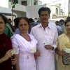 A family holds up voter ID cards, complaining that their names are missing from the electoral rolls. Credit: Beena Sarwar/IPS 