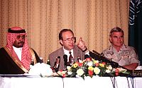 U.S. Defence Secretary William Perry (centre) fields questions about the Khobar bombing on Jun. 29, 1996, with Saudi Prince Bandar Bin Sultan (left) and CENTCOM commander Gen. J.H. Binford Peay III.  Credit: U.S. Defence Dept.