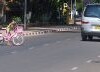 Girls dash across the road. Road users observe a sort of caste system where the motorised have right of way.  Credit: Melody Kemp/IPS