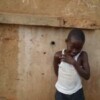 Bullet holes mark a wall in Matadi, which has witnessed clashes between government and the Bundu dia Kongo. Credit: Michael Deibert/IPS