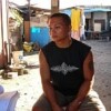 Ramil Autencio outside his home in Manila. Credit: David Phinney