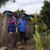 Extension worker Moises Sitoe talking to Gonçalves Mandlate outside his home. Credit: Ruth Ayisi