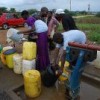 Residents of Mabvuku and elsewhere gather water at a police camp borehole. Credit: Taurai Maduna/IPS