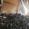 A pile of charred bottles lie in waste in a warehouse facility of the United Nations Relief and Works Agency for the Palestine Refugees in the Near East (UNRWA). Credit: UN Photo/Eskinder Debebe 