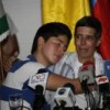 Alan Jara hugs his son at Tuesday's press conference.  Credit: Constantino Castelblanco/Gobernación del Meta