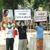 Masked Burmese women outside the office of Indian leader Sonia Gandhi on Friday, appealing for help  Credit: Huapi/Mizzima News