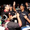 Police trying to disperse a candlelight vigil against the arrest of dissenters under internal security laws.  Credit: Baradan Kuppusamy/IPS