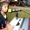 A child broadcasting at DXUP FM community radio. Credit: Kalinga Seneviratne/IPS
