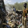 Sudanese youth scavenge for food and clothing in a municipal garbage dump in Juba on Sep. 4, 2008. Credit: UN Photo/Tim McKulka 