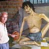 Chum Mey beside a Vann Nath depiction at Tuol Slein, the former Khmer Rouge prison.  Credit: Marwaan Macan-Markar/IPS