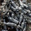 PTAB submunitions piled up near Bagram, Afghanistan in 2002, part of a munitions dump holding 60,000 tonnes of unexploded ordnance.  Credit: John Rodsted