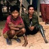 Two victims of cluster munitions in Ta Oy Province, Laos. Credit: John Rodsted