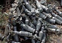 PTAB submunitions piled up near Bagram, Afghanistan 2002. Part of a munition dump containing 60,000 tonnes of unexploded ordnance. Credit: John Rodsted