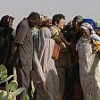 Reed Brody (centre) with mourning widows at a site where victims of political repression were buried. Credit: "The Dictator Hunter"
