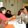 A senator and a leader from Coordinadora de la Mujer shake hands on the parliamentary pact. Credit: Franz Chávez/IPS