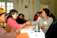 A senator and a leader from Coordinadora de la Mujer shake hands on the parliamentary pact. Credit: Franz Chávez/IPS