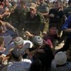 Protesting settlers scuffle with Israeli soldiers and policemen at the scene of a house demolition. Credit: Ahikam Seri - panos pictures