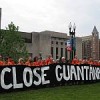 The defendants prepare for trial, holding a banner in front of the U.S. Supreme Court.  Credit: Bill Ofenlach