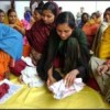 Teaching women in Muzaffarpur, Bihar state, to make sanitary napkins Credit: Goonj