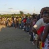 Haitians displaced by the massive earthquake that devastated their country form a long line to wait for UN-distributed meals. Credit: UN Photo/Logan Abassi