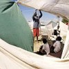 A man sets up a shelter in Cité Soleil, Haiti.  Credit: UN Photo/Logan Abassi 