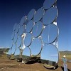 Heliostats, like the one pictured above, collect solar energy for power tower plants. About 5,000 of these would be used in a 100-MW commercial plant. Credit: Sandia National Laboratory