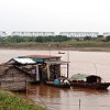 Nguyen Thi Thu Hang's houseboat on the polluted Red River near central Hanoi.  Credit: Helen Clark/IPS