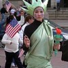 A young woman dressed as the Statue of Liberty at an immigrants&#39 rights march in Boston in April 2006. Credit: Philocrities