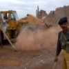 A Pakistani soldier oversees demolitions at the Jalozai Afghan refugee camp Credit: Ashfaq Yusufzai/IPS
