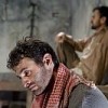 Arian Moayed and Daoud Heidami (background) in a scene from "Masked". Credit: Aaron Epstein