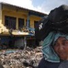 An Indonesian woman contemplates the destruction wrought by the tsunami. (Photo: Achmad Ibrahim) Credit: PictureNET Africa