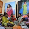 Kousalya Periasamy (in green with a black handbag) presides over a PWN Plus meeting in Chennai Credit: PWN/IPS